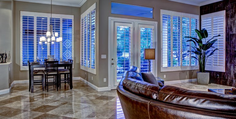 Dallas great room with plantation shutters and tile floor.
